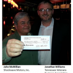 John McMillian, Shockwave Motors, Inc. receives grant check from TVBA funded by Vanquish Worldwide.
